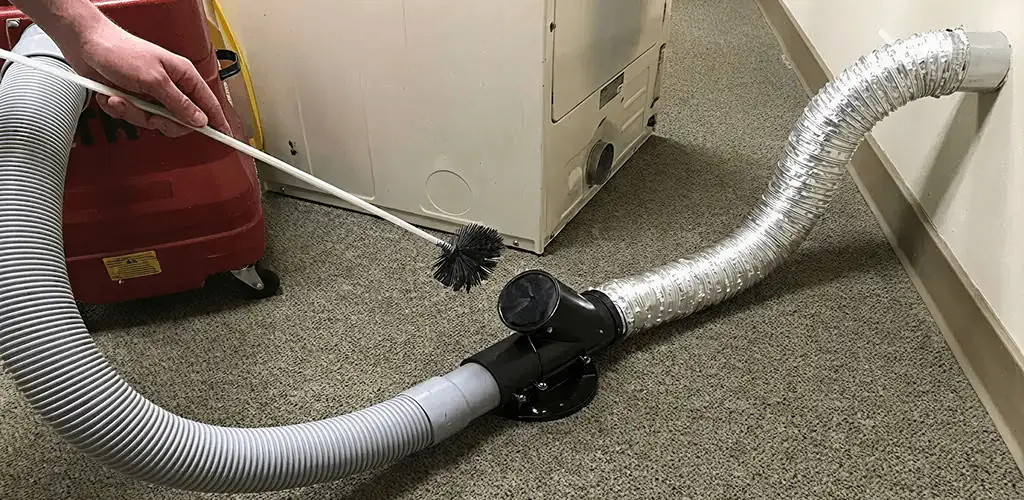 Dryer vent cleaning service removing lint from a dryer duct connection in Hialeah, FL