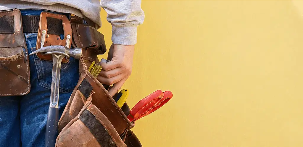 Handyman with tool belt ready for home repairs and maintenance in Hialeah, FL