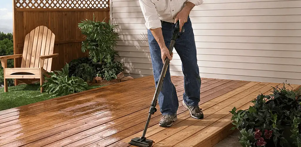 Deck staining service applying stain to a backyard wood deck in Hialeah, FL